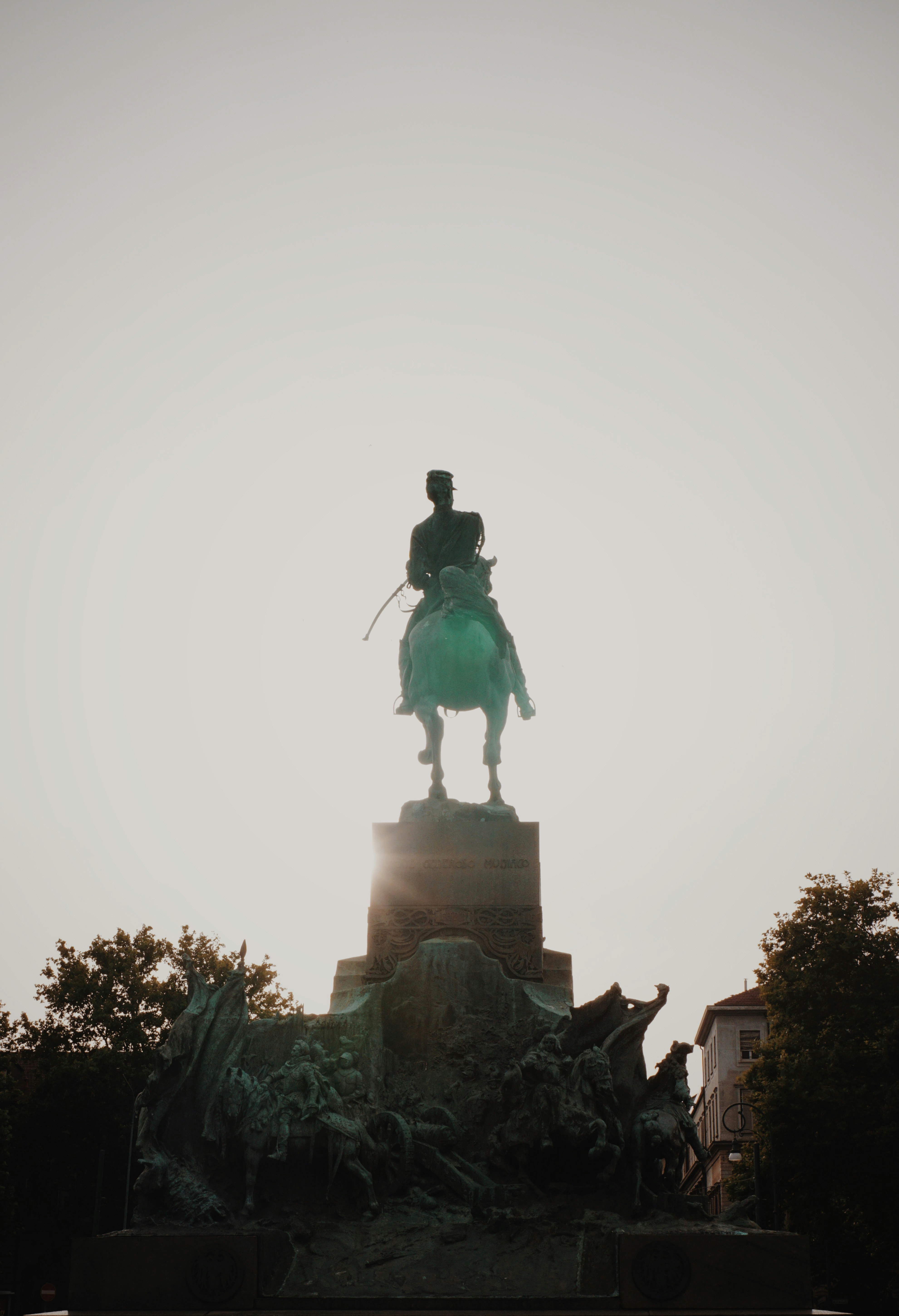 statue of man riding horse